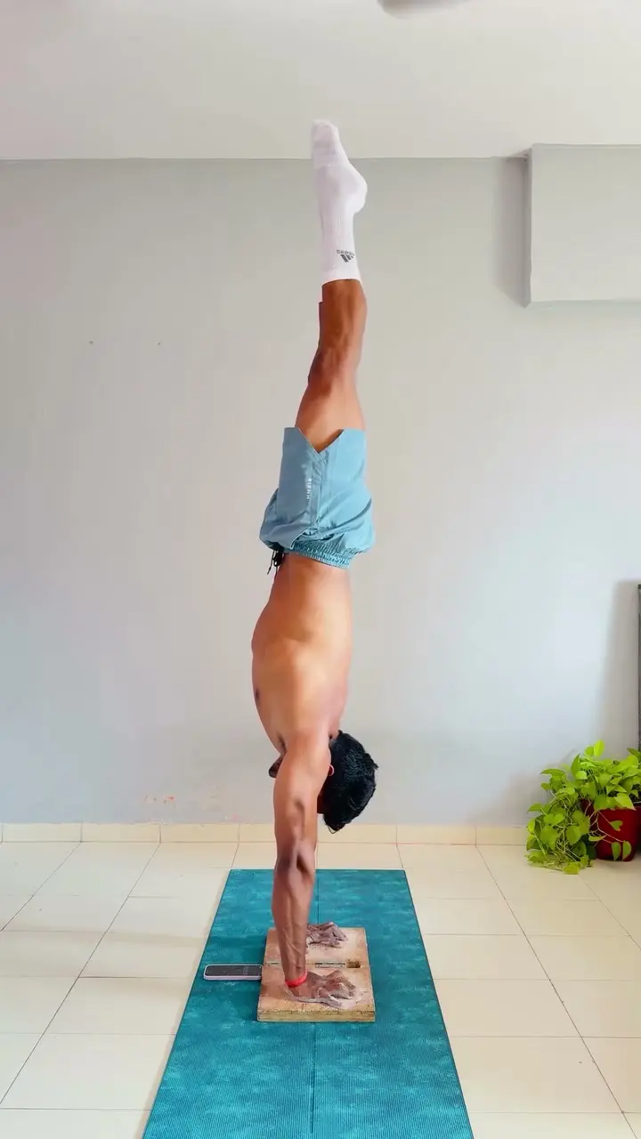 Handstand practice on blocks, video still